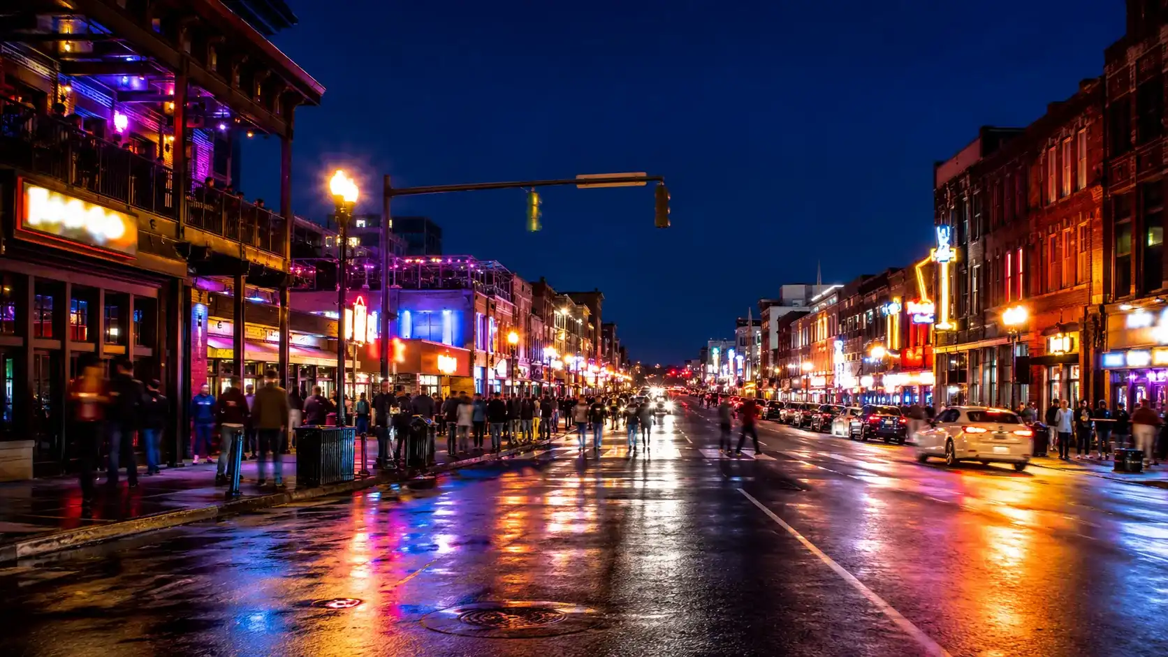 Neon Broadway street scene in Nashville at night for entertainment tour logistics